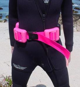 Diver wearing hard weight belt.